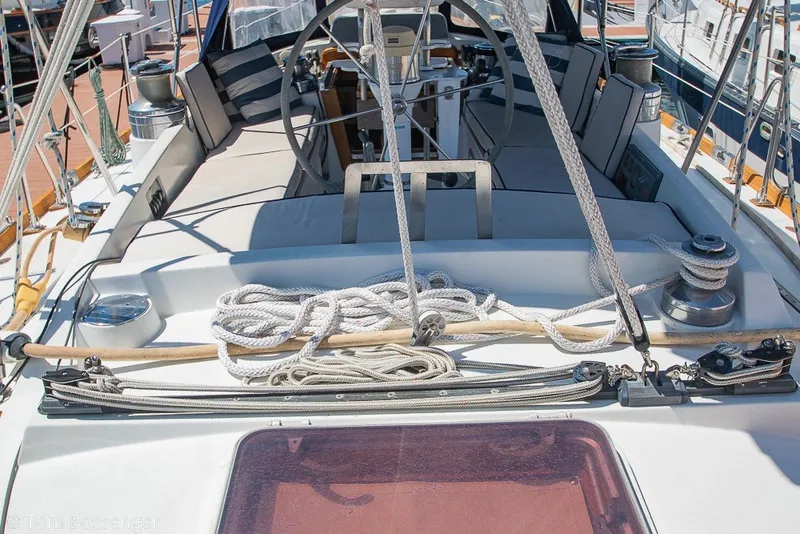 Slide: The Image of 1988 Hylas 44 Center Cockpit sailboat deck with ropes and winches. - 56