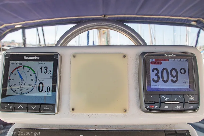 Slide: The Image of Cockpit instruments on a 1988 Hylas 44 Center Cockpit sailboat, displaying navigation data. - 49
