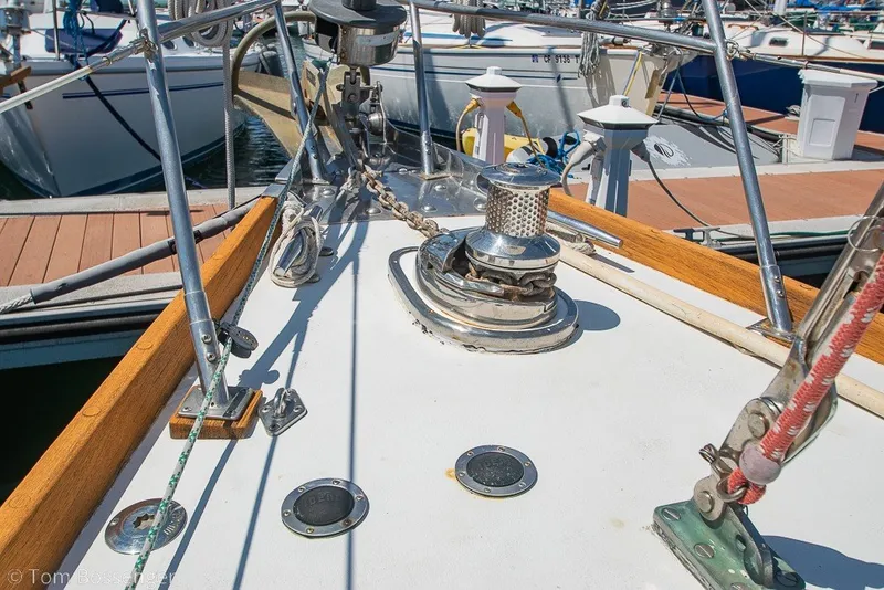 Slide: The Image of Deck of 1988 Hylas 44 Center Cockpit yacht with anchor chain and winch. - 70