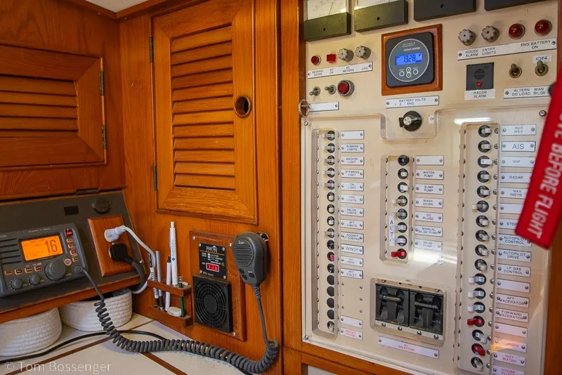 Slide: The Image of Control panel of a 1988 Hylas 44 Center Cockpit sailboat with radio and switches. - 37