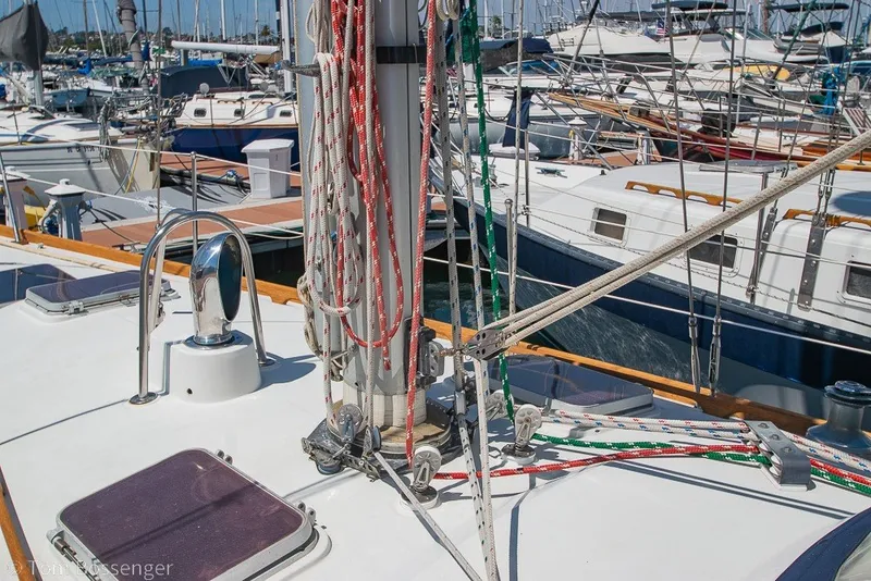 Slide: The Image of 1988 Hylas 44 Center Cockpit sailboat deck with rigging and marina background. - 66