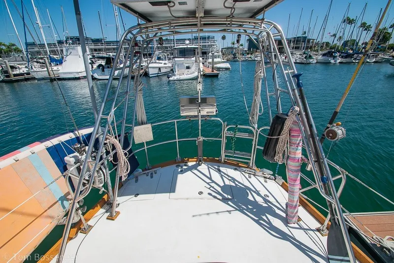 Slide: The Image of Sailboat deck view of 1988 Hylas 44 Center Cockpit in marina setting. - 52