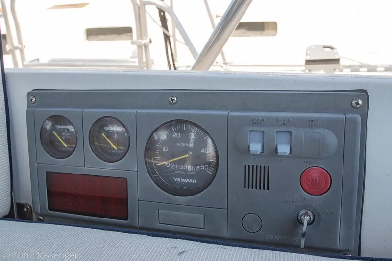 Slide: The Image of Control panel of a 1988 Hylas 44 Center Cockpit sailboat with gauges and switches. - 77