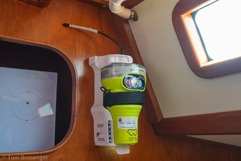 Slide: The Image of Emergency beacon mounted inside a 1988 Hylas 44 Center Cockpit sailboat cabin. - 42