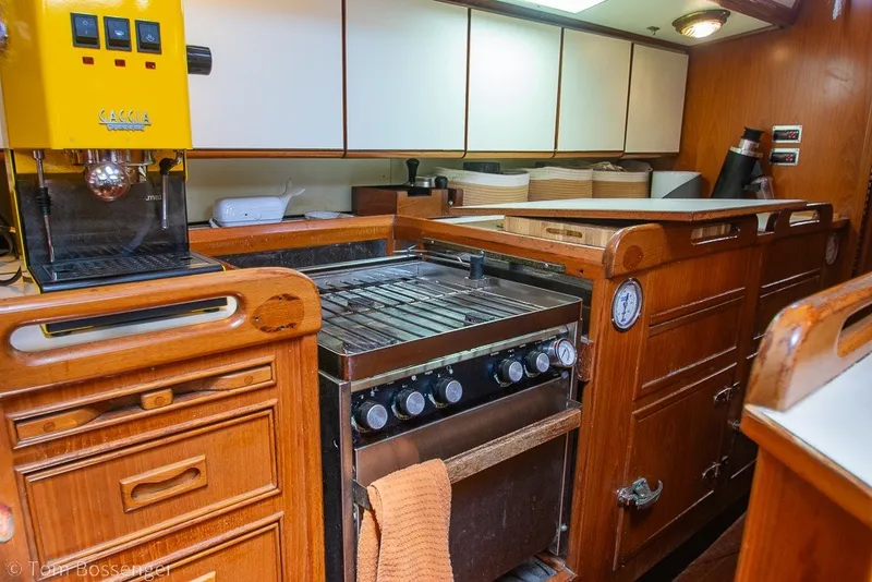 Slide: The Image of Galley kitchen in 1988 Hylas 44 Center Cockpit yacht with stove and espresso machine. - 17