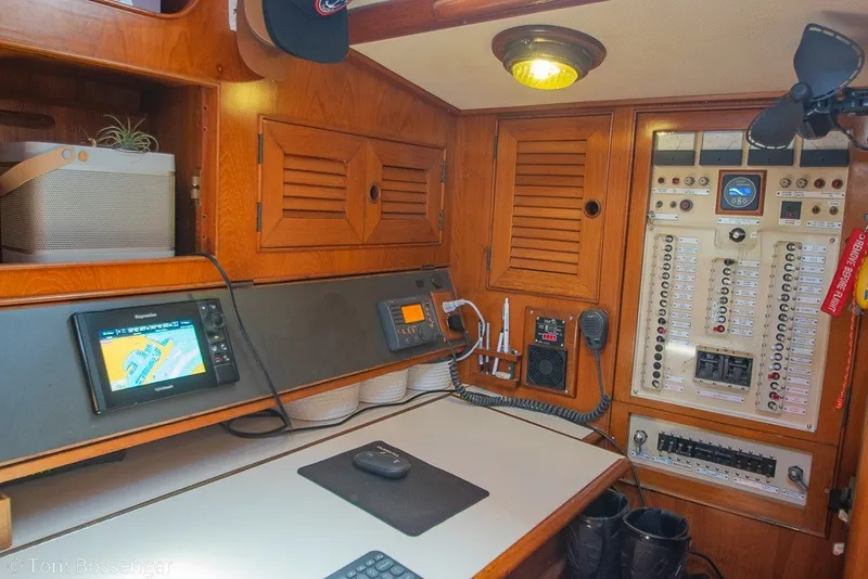 Slide: The Image of Navigation and control panel inside a 1988 Hylas 44 Center Cockpit sailboat. - 35