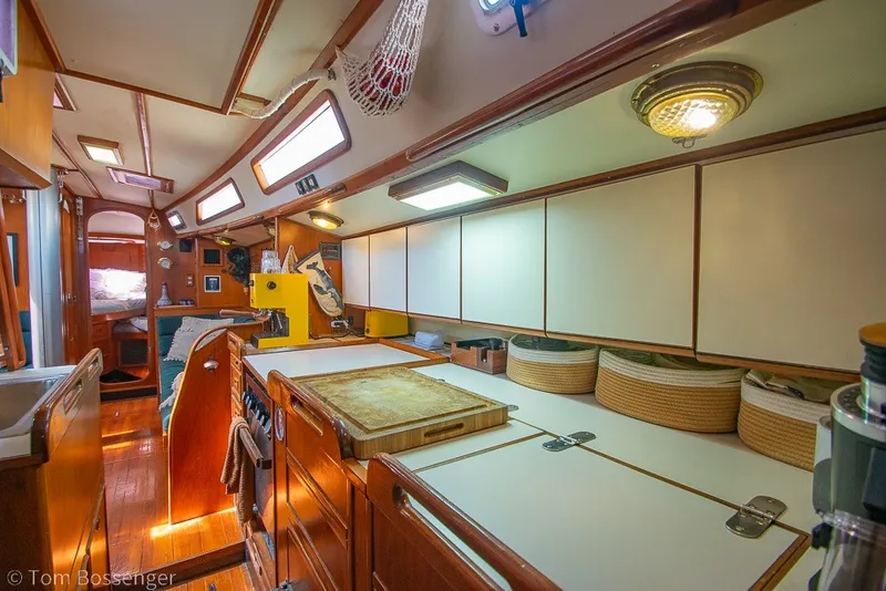 Slide: The Image of Interior of 1988 Hylas 44 Center Cockpit yacht with wooden cabinetry and modern amenities. - 16