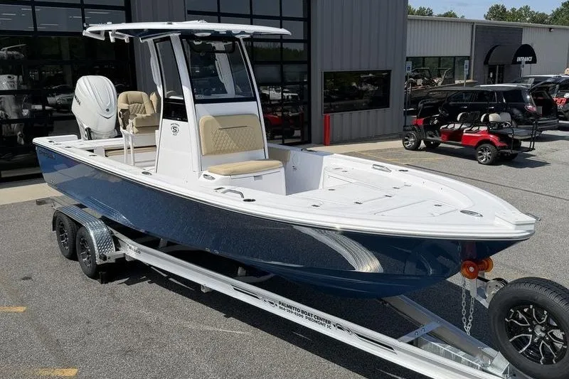 Slide: The Image of 2027 Sportsman Masters 247 Bay Boat on trailer, parked outside dealership. - 11