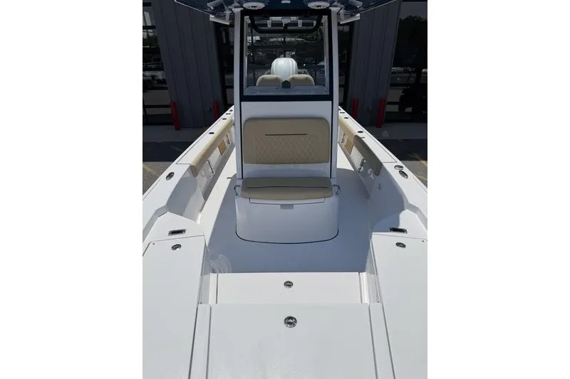 Slide: The Image of 2027 Sportsman Masters 247 Bay Boat interior with seating and storage compartments. - 31