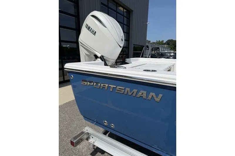 Slide: The Image of 2027 Sportsman Masters 247 Bay Boat with Yamaha engine, parked outdoors. - 6