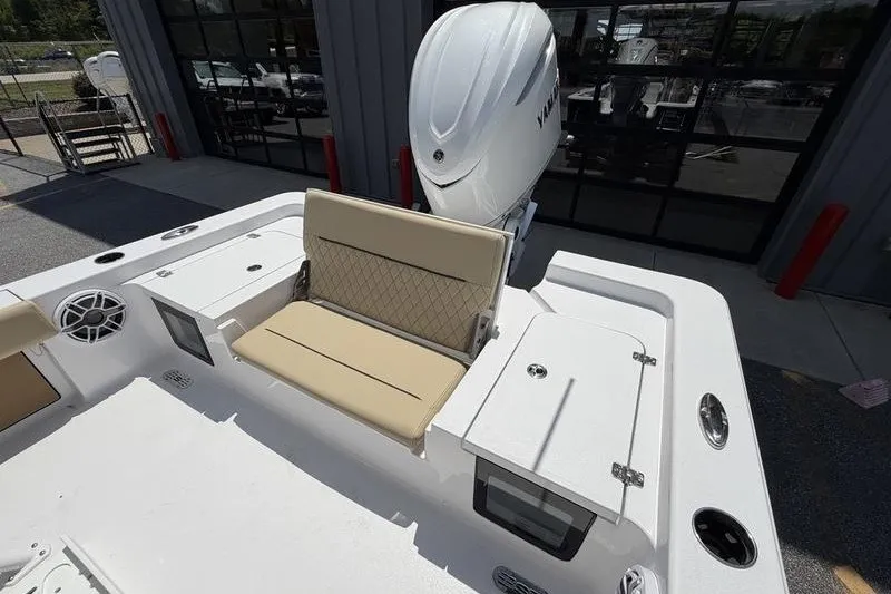 Slide: The Image of 2027 Sportsman Masters 247 Bay Boat with beige seating and Yamaha outboard motor. - 15