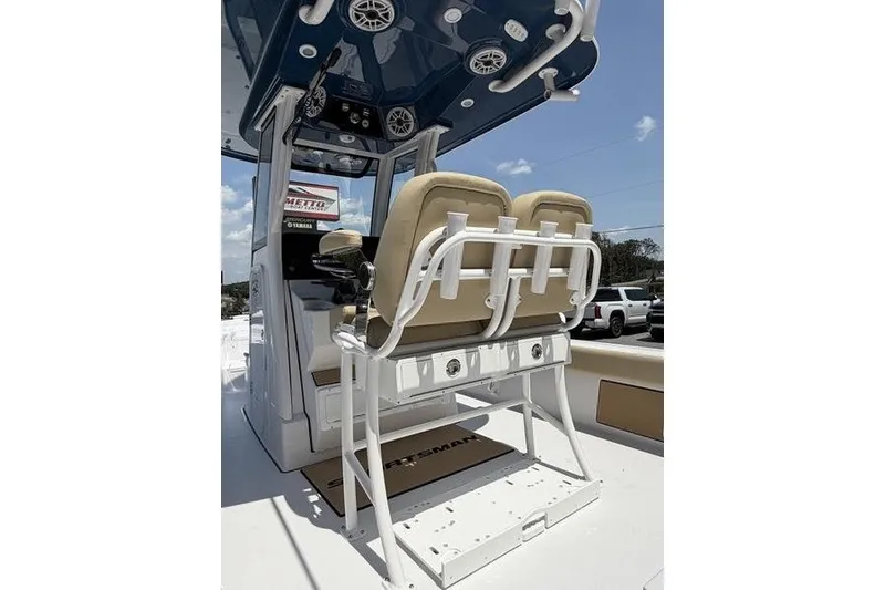 Slide: The Image of 2027 Sportsman Masters 247 Bay Boat interior with dual seats and console. - 13