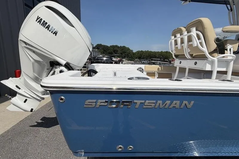 Slide: The Image of 2027 Sportsman Masters 247 Bay Boat with Yamaha engine, blue hull, and beige seating. - 8