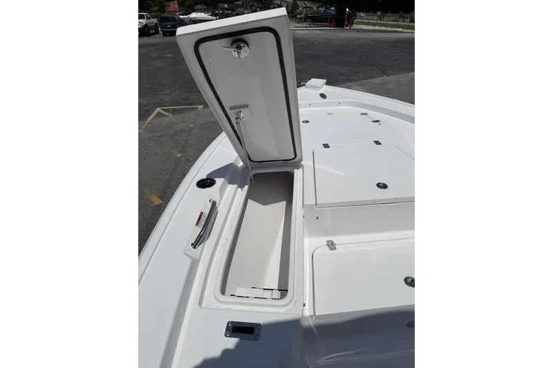 Slide: The Image of 2027 Sportsman Masters 247 Bay Boat with open storage compartment on deck. - 28