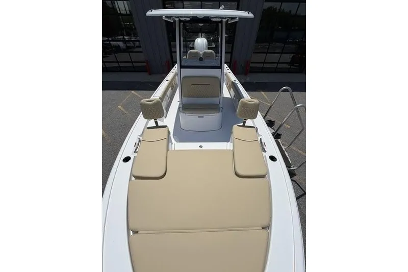 Slide: The Image of 2027 Sportsman Masters 247 Bay Boat with beige seating and sleek design. - 12