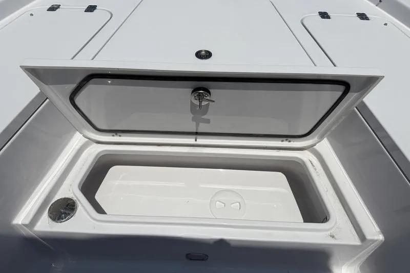 Slide: The Image of Open storage compartment on 2027 Sportsman Masters 247 Bay Boat deck. - 32