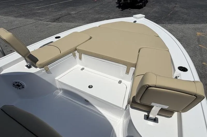 Slide: The Image of 2027 Sportsman Masters 247 Bay Boat with beige seating and storage compartment. - 30