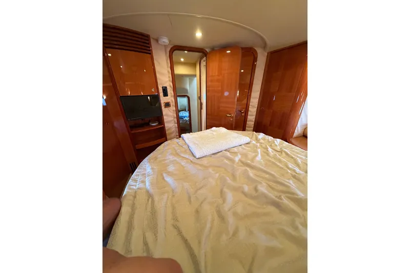 Slide: The Image of Luxurious cabin interior of 2006 Azimut 55E yacht with elegant wood finishes. - 33