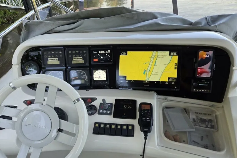 Slide: The Image of Control panel of a 2006 Azimut 55E yacht with navigation and communication equipment. - 18