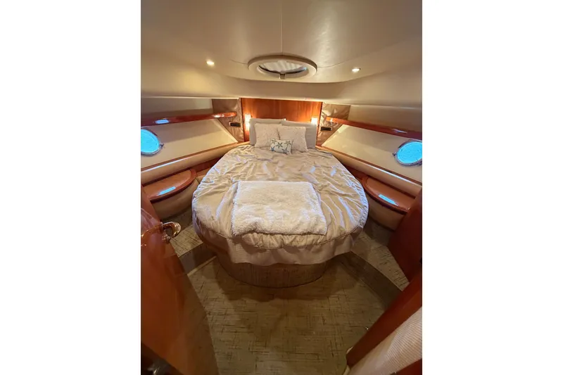 Slide: The Image of Luxurious bedroom interior of 2006 Azimut 55E yacht with cozy bedding and elegant design. - 34