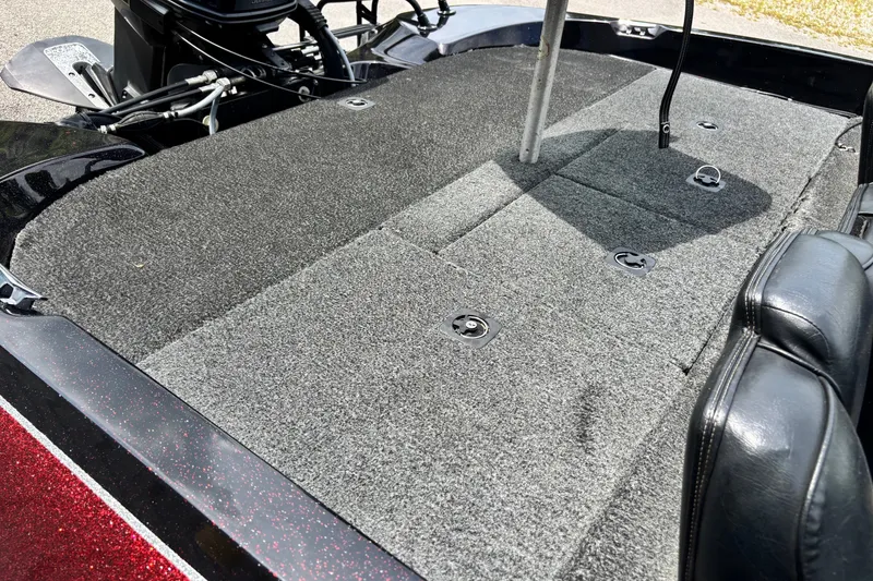 Slide: The Image of 1997 Stratos 282 DC boat deck with carpeted surface and seating area. - 9