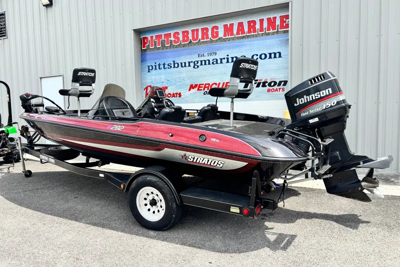 Slide: The Image of 1997 Stratos 282 DC boat with Johnson 150 engine at Pittsburg Marine dealership. - 12