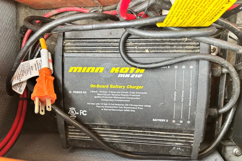 Slide: The Image of Minn Kota MK210 on-board battery charger in a 1997 Stratos 282 DC boat. - 11
