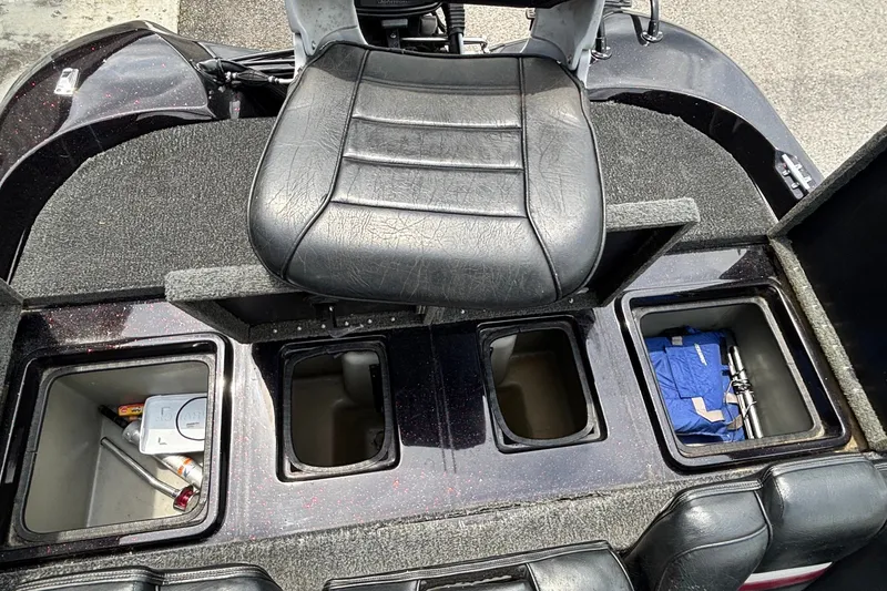 Slide: The Image of 1997 Stratos 282 DC boat interior with storage compartments and seating. - 10