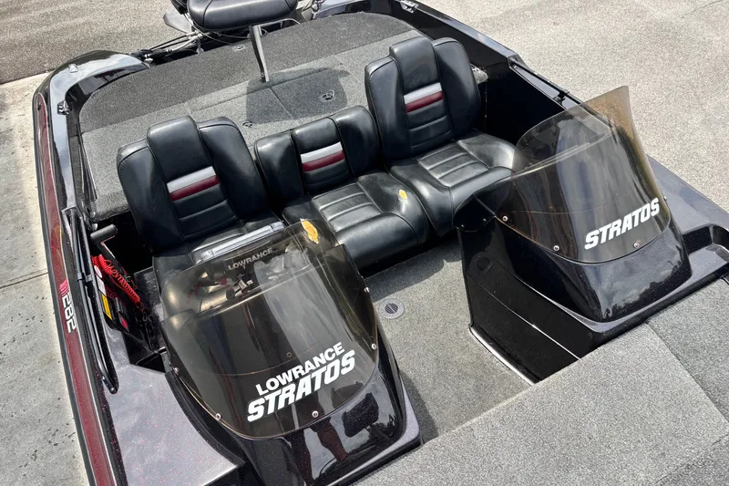 Slide: The Image of 1997 Stratos 282 DC boat interior with black leather seats and dual windshields. - 7
