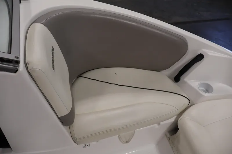 Slide: The Image of 2011 Sea-Doo Challenger 180 boat seat with beige and gray upholstery. - 12