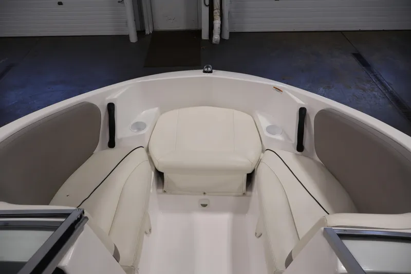 Slide: The Image of 2011 Sea-Doo Challenger 180 boat interior with white seating and cup holders. - 11