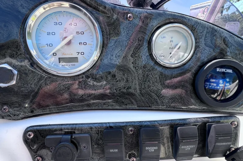 Slide: The Image of Dashboard of a 2005 Hurricane FunDeck GS 202 OB boat with gauges and switches. - 32