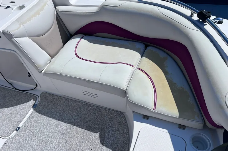 Slide: The Image of 2005 Hurricane FunDeck GS 202 OB boat seating with white and purple upholstery. - 7