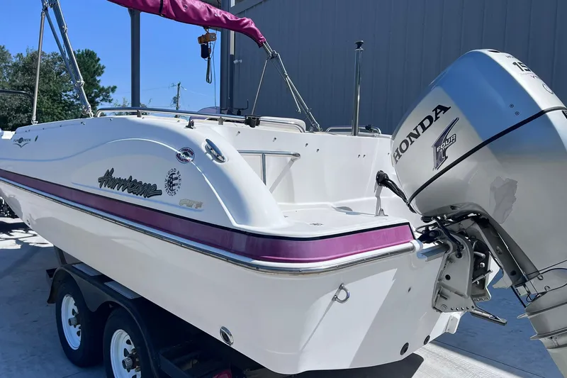 Slide: The Image of 2005 Hurricane FunDeck GS 202 OB boat with Honda outboard motor on trailer. - 40