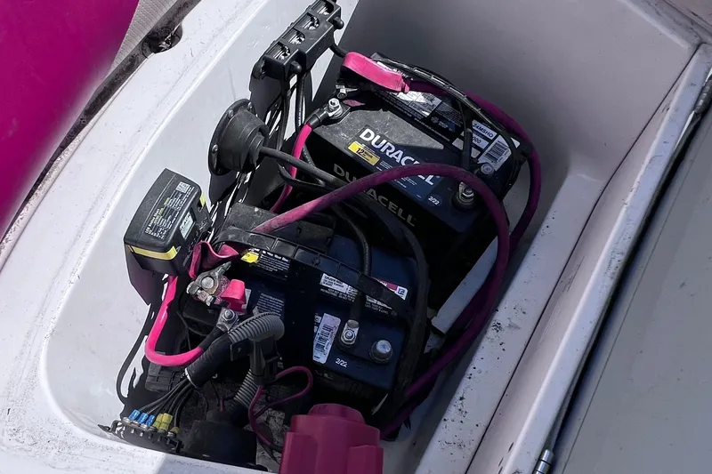 Slide: The Image of Battery compartment of a 2005 Hurricane FunDeck GS 202 OB boat with visible wiring. - 21