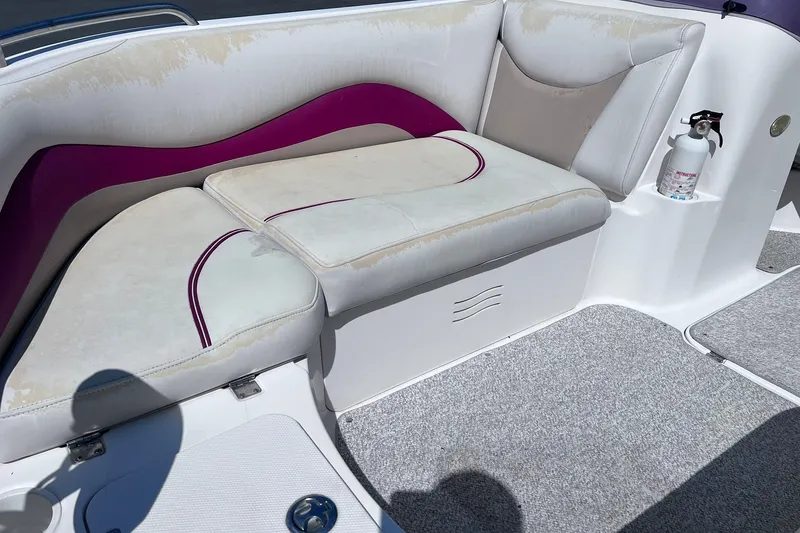 Slide: The Image of 2005 Hurricane FunDeck GS 202 OB boat interior with cushioned seating and fire extinguisher. - 8