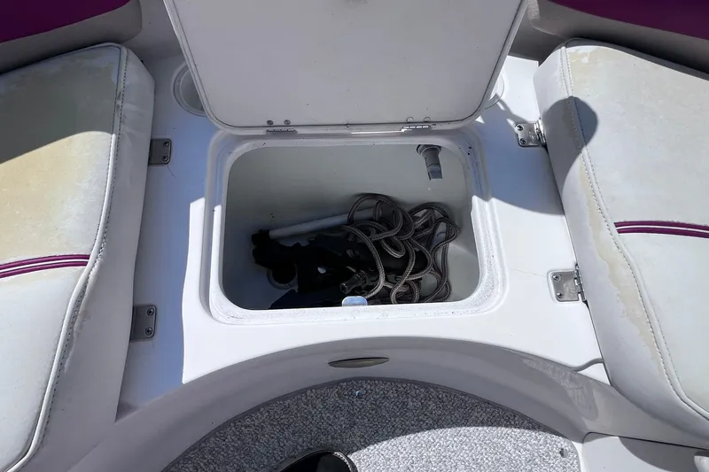 Slide: The Image of Storage compartment on a 2005 Hurricane FunDeck GS 202 OB boat with coiled rope inside. - 15