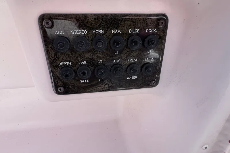 Slide: The Image of Control panel of a 2005 Hurricane FunDeck GS 202 OB boat with labeled switches. - 36