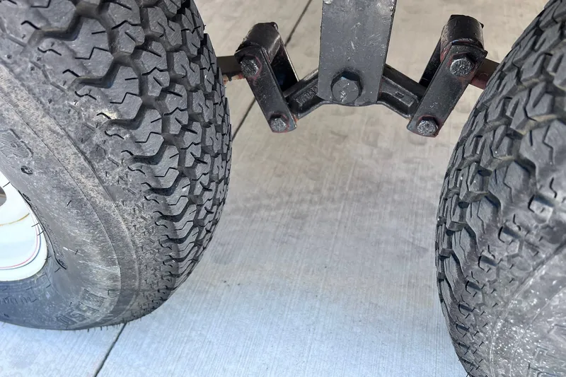 Slide: The Image of Close-up of dual trailer tires with visible tread pattern, 2005 Hurricane FunDeck GS 202 OB. - 44