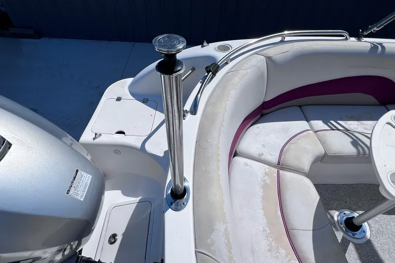 Slide: The Image of 2005 Hurricane FunDeck GS 202 OB boat interior with seating and motor detail. - 25