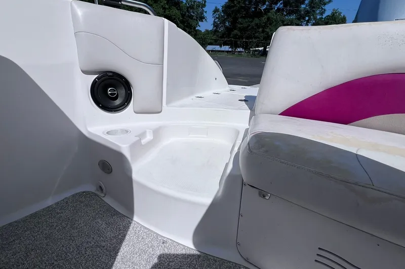 Slide: The Image of 2005 Hurricane FunDeck GS 202 OB boat interior with speaker and seating. - 20