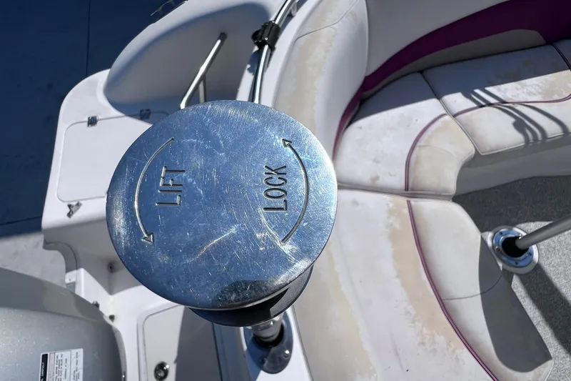 Slide: The Image of Close-up of a 2005 Hurricane FunDeck GS 202 OB boat seat adjustment mechanism. - 26