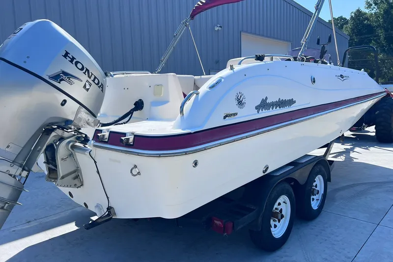 Slide: The Image of 2005 Hurricane FunDeck GS 202 OB boat with Honda outboard motor on trailer. - 2