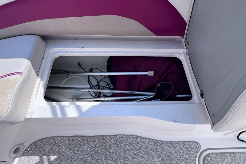 Slide: The Image of Storage compartment of 2005 Hurricane FunDeck GS 202 OB boat with equipment inside. - 22