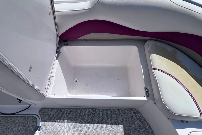 Slide: The Image of Open storage compartment on 2005 Hurricane FunDeck GS 202 OB boat interior. - 14