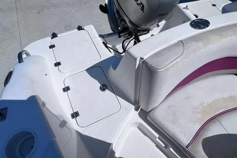 Slide: The Image of 2005 Hurricane FunDeck GS 202 OB boat interior with storage compartments and seating. - 23