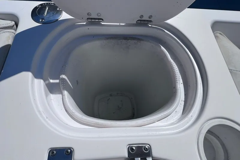 Slide: The Image of Open storage compartment on 2005 Hurricane FunDeck GS 202 OB boat. - 13