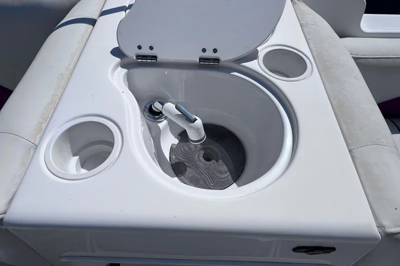 Slide: The Image of 2005 Hurricane FunDeck GS 202 OB boat sink with cup holders and faucet. - 12