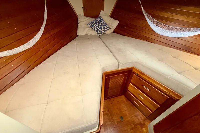 Slide: The Image of Cozy cabin interior of 1988 Grand Banks 42 Classic with wooden finish and cushioned bed. - 47