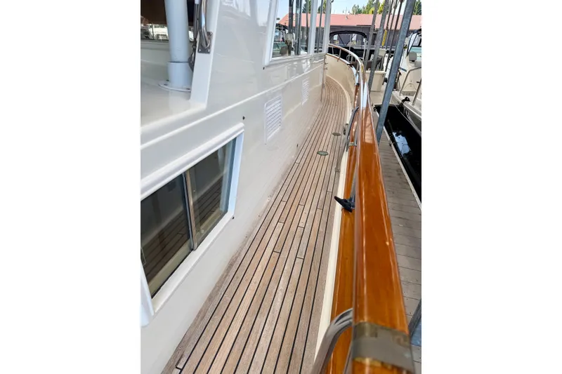 Slide: The Image of Side deck view of 1988 Grand Banks 42 Classic yacht with teak flooring. - 16